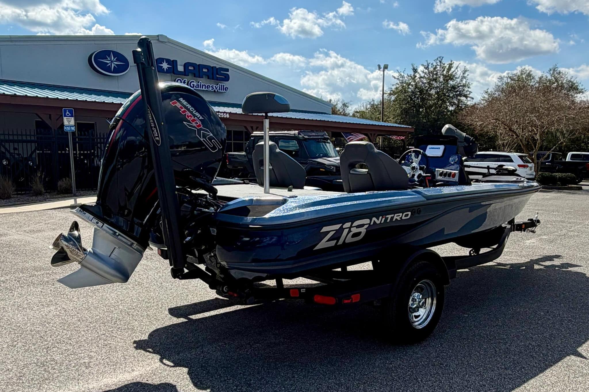 2026 Nitro Z18 boat parked outdoors, showcasing sleek design and powerful engine.