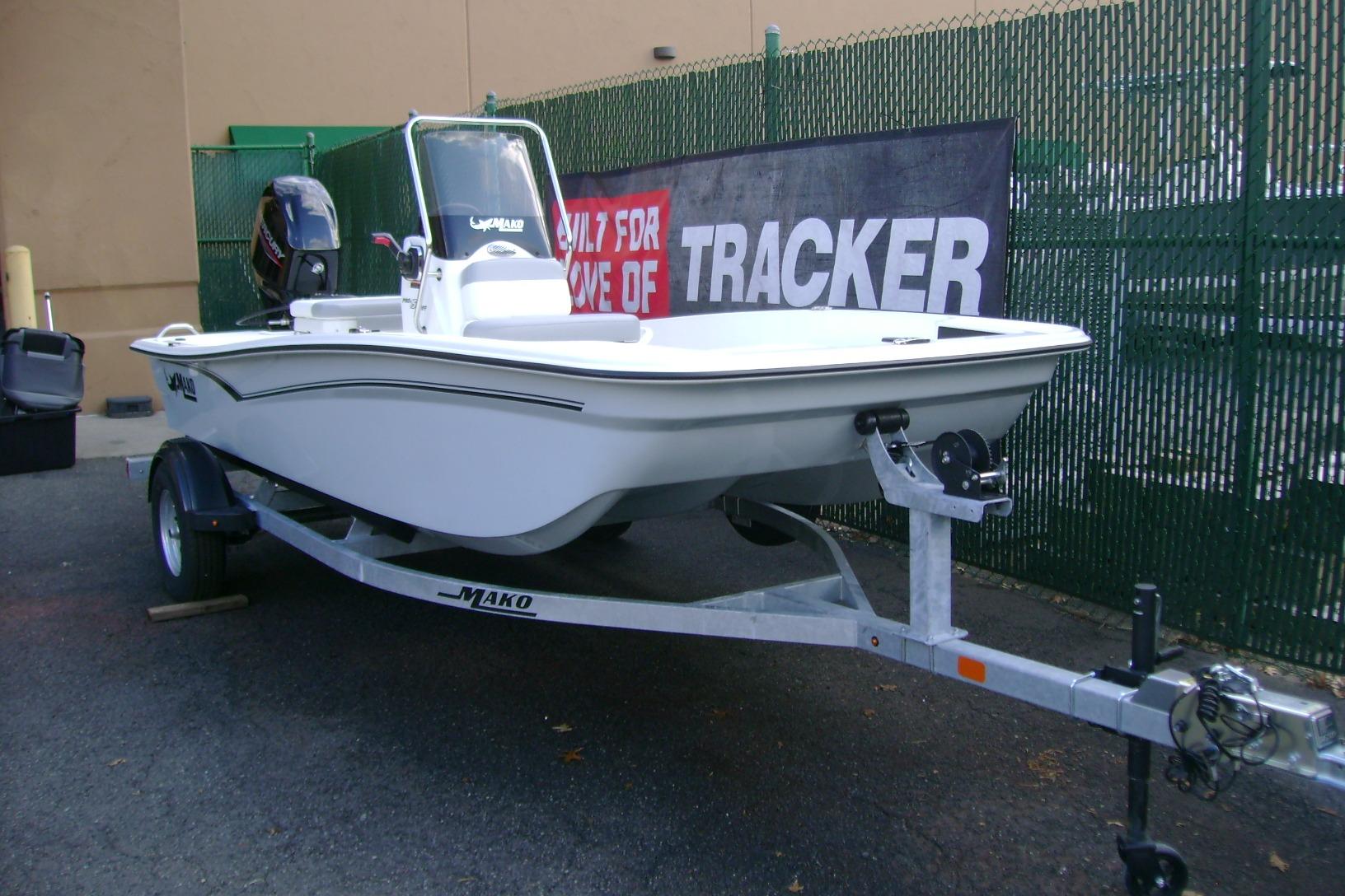 2026 Mako Pro Skiff 15 CC boat on trailer, displayed outdoors.