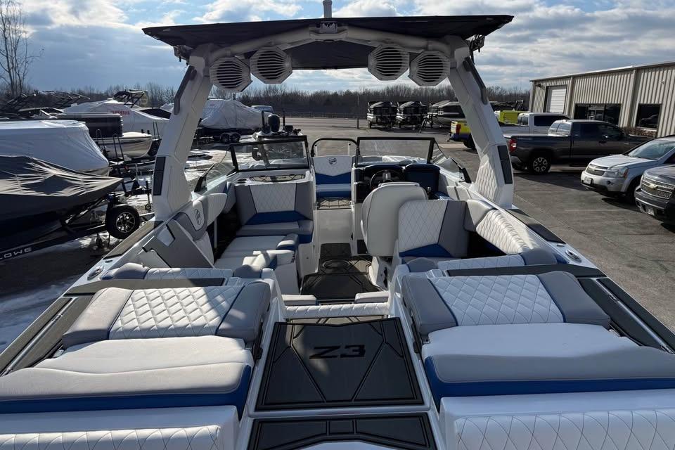 2026 Tigé Z3 boat interior with luxurious seating and modern design at a marina.