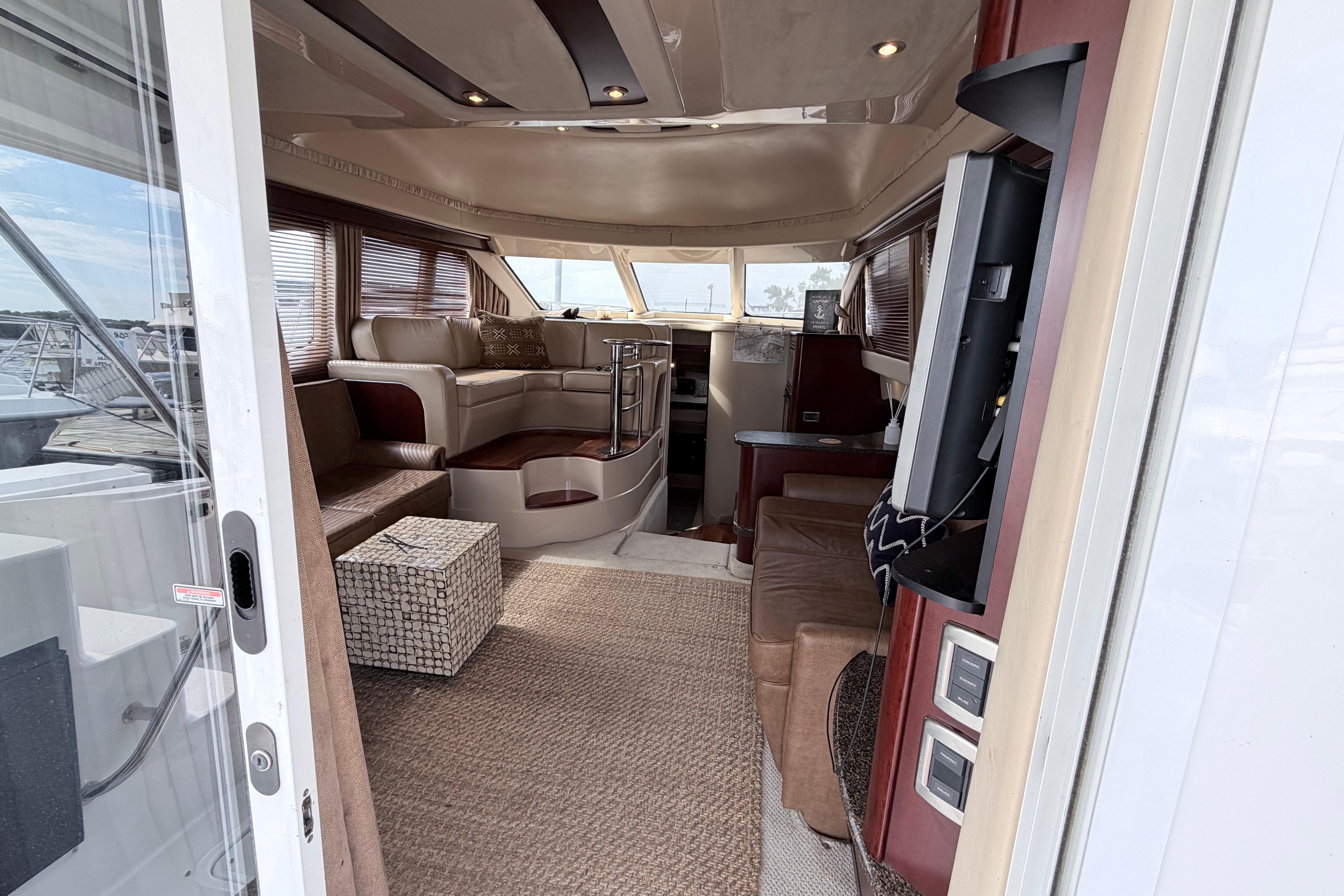 Luxurious interior of a 2005 Sea Ray 420 Sedan Bridge yacht with elegant seating and modern amenities.