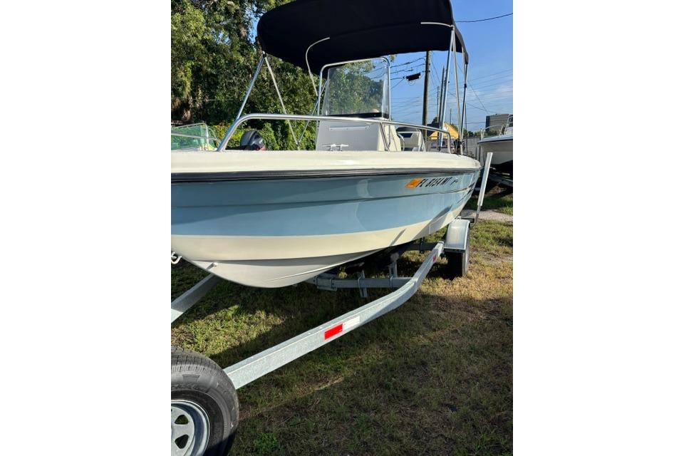 2005 Hydra-Sports Lightning 180 CC boat on trailer, featuring a sleek design and canopy.