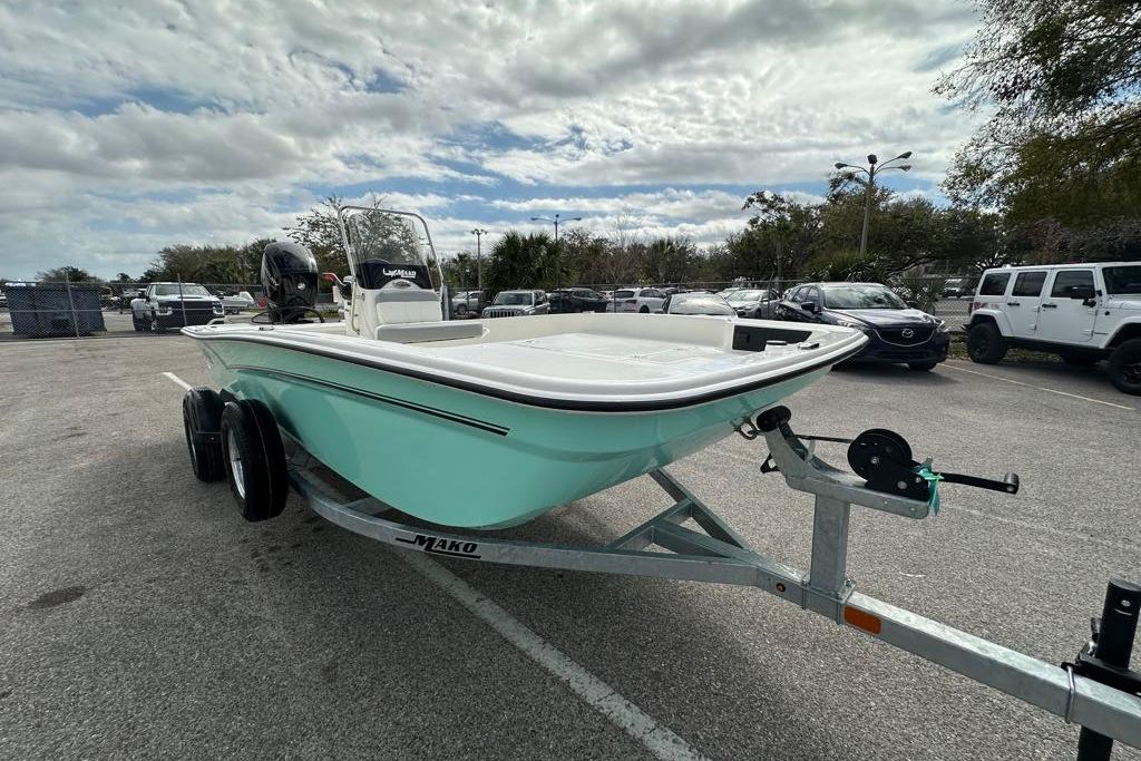 2026 Mako Pro Skiff 17 CC boat on trailer in parking lot.