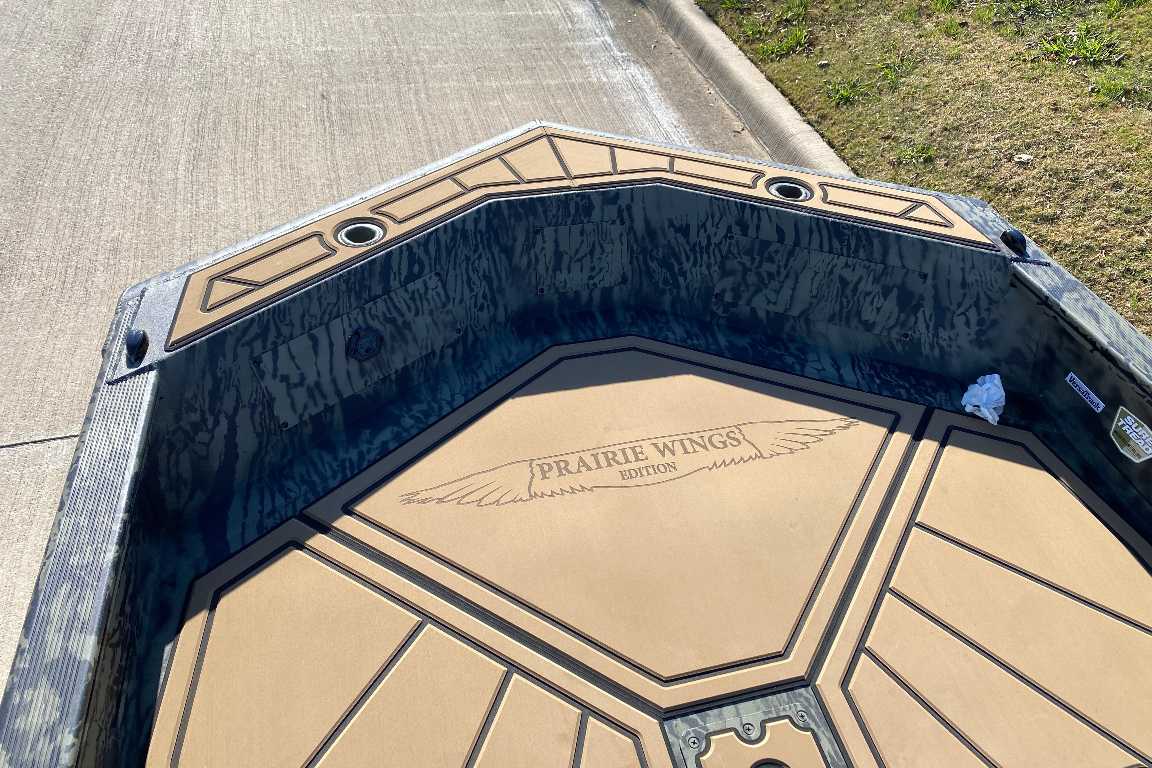 2026 Tracker Grizzly 1650 T Prairie Wings Edition boat interior with custom flooring design.