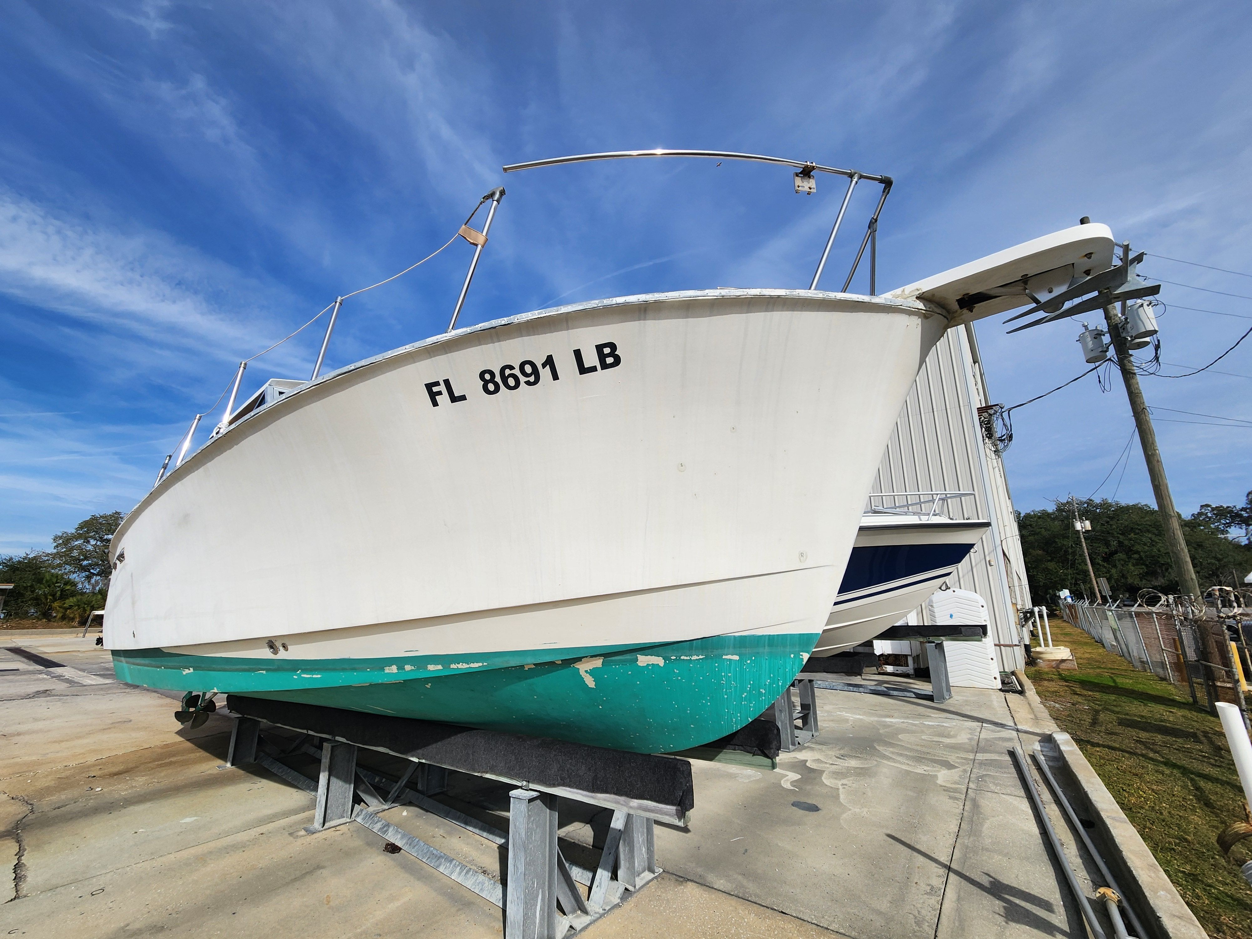 1967 Hatteras 28ft boat on a dry dock.