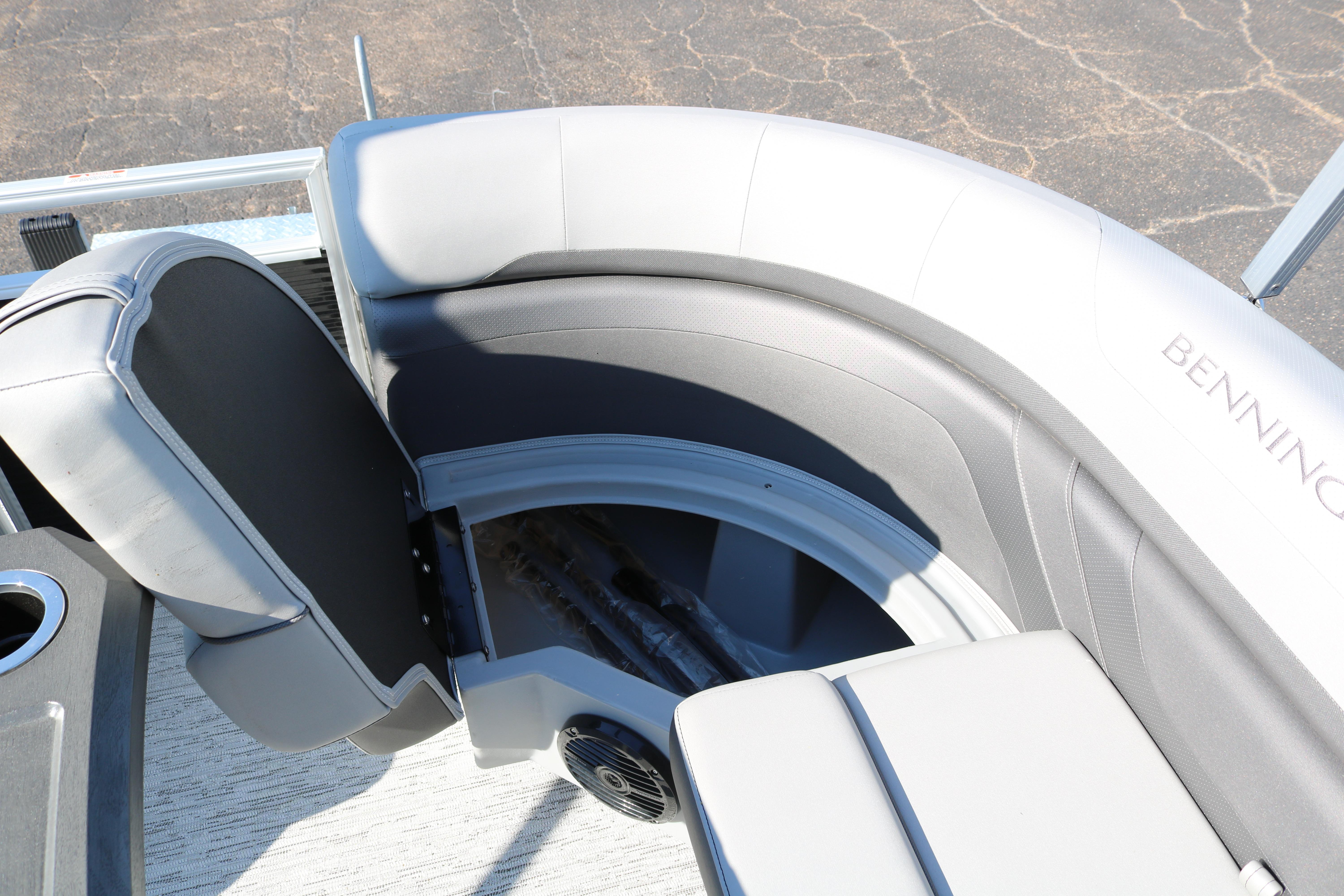 2026 Bennington 22SX Stern Radius boat interior with curved seating and cup holder.
