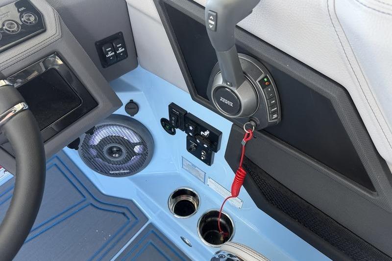 2026 Cobalt R8 Surf boat interior with controls, speaker, and cup holders.