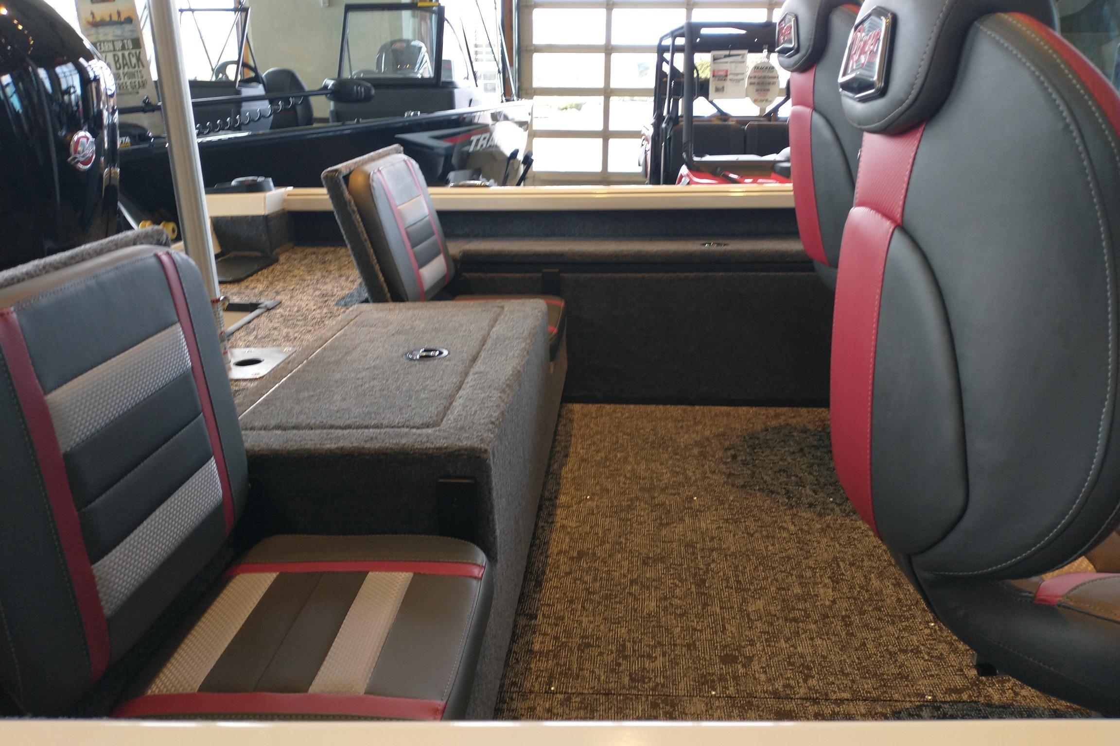 2026 Ranger VS1682SC Reata boat interior with cushioned seating and carpeted flooring.