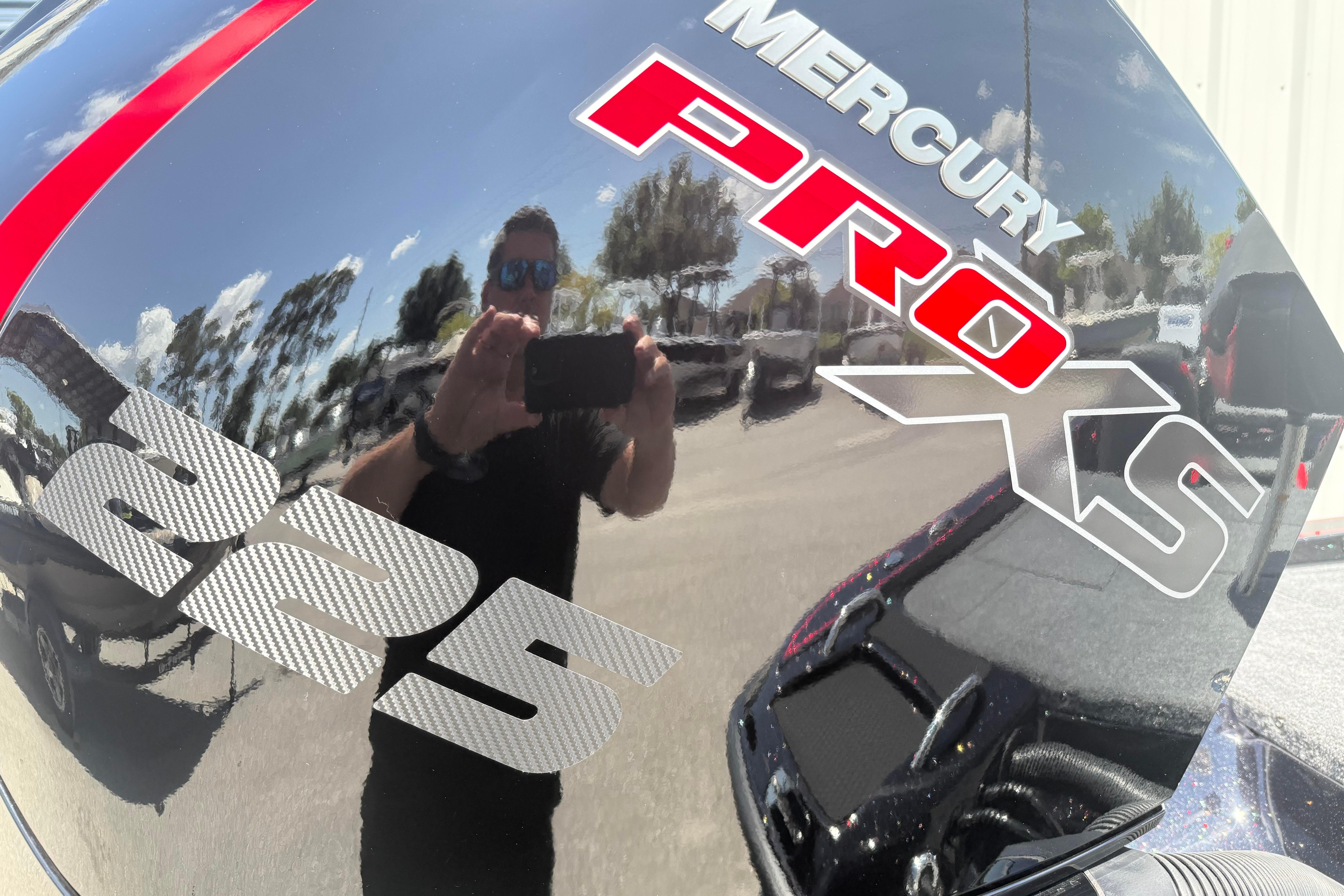 Mercury Pro XS 225 engine on a Phoenix 919 ZXL, 2027 model, with reflection.