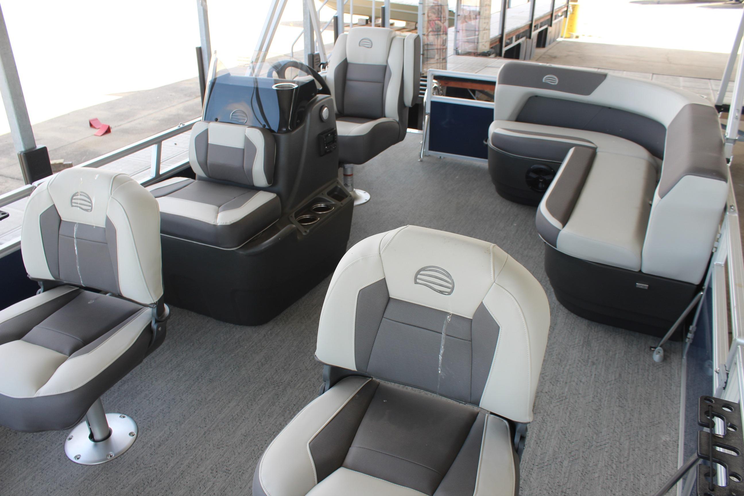 2026 Sun Tracker Bass Buggy 16 XL Select pontoon boat interior with seating and helm.