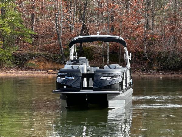 2025 Montara Surf Boss 2.0 25 pontoon boat on a calm lake.