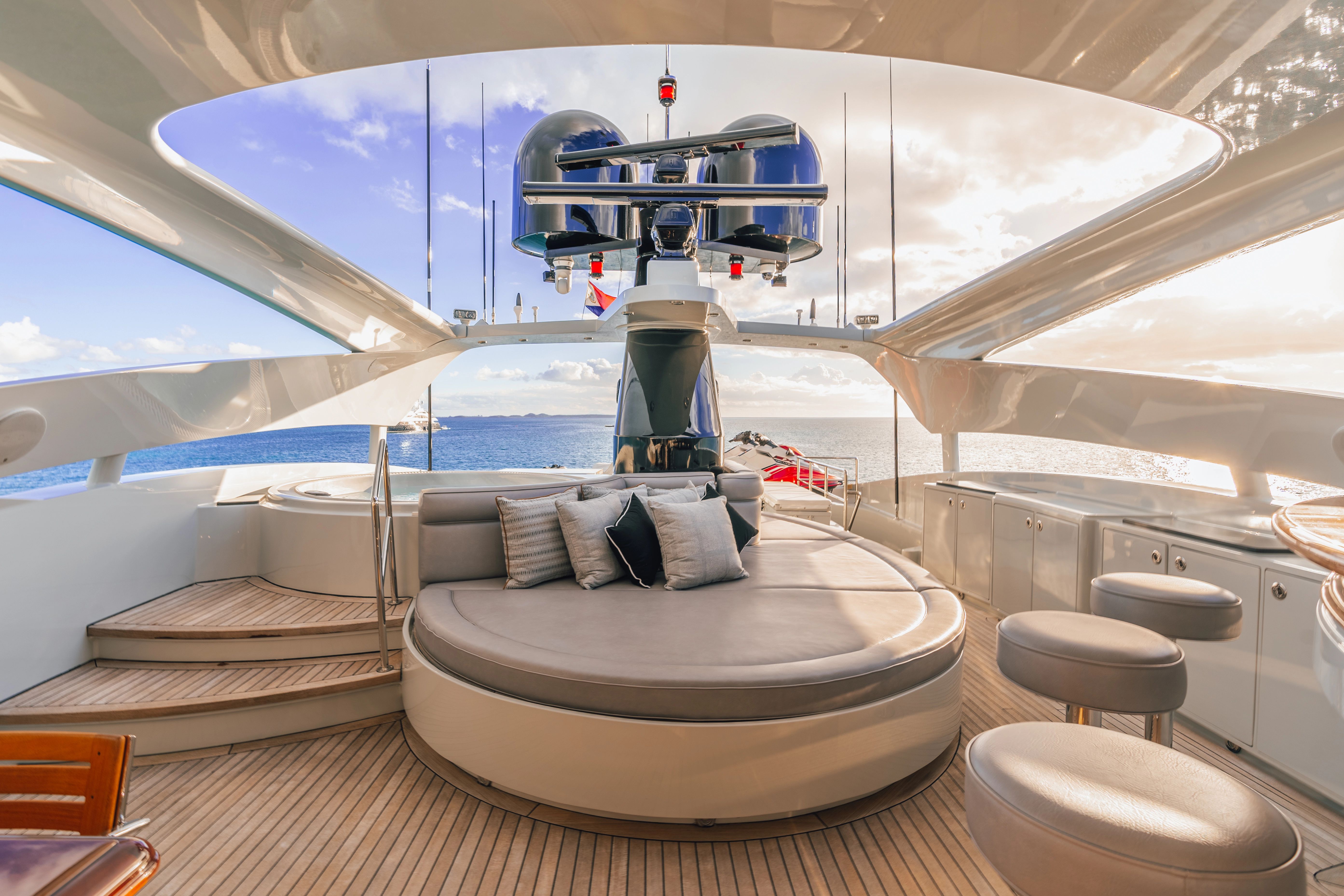 Luxurious deck of a 2005 Palmer Johnson Raised Pilothouse yacht with elegant seating.