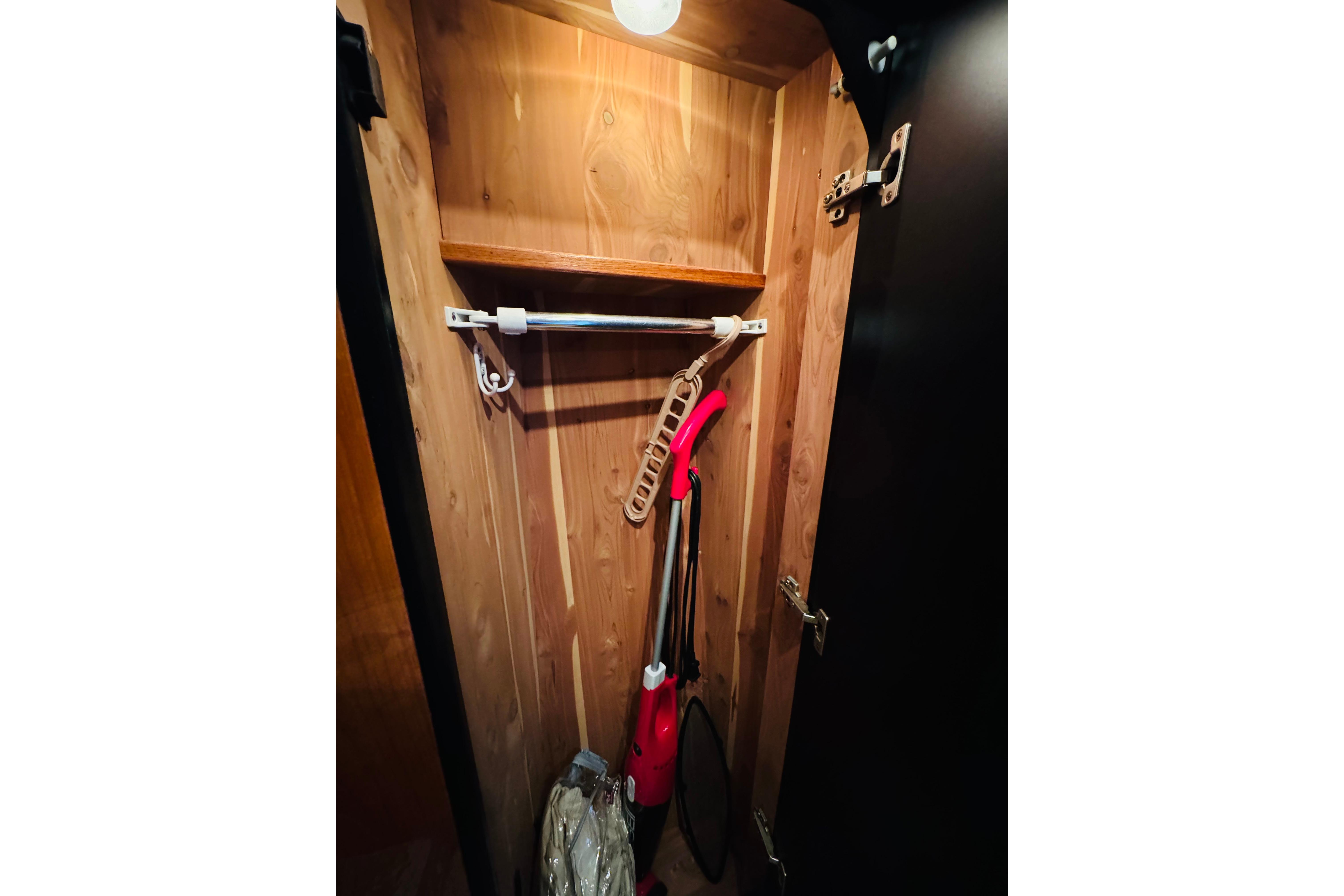 Wooden closet interior on a 2000 Sea Ray 400 Sedan Bridge yacht.