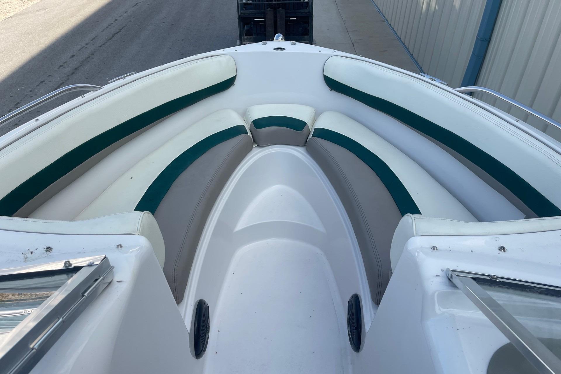 1996 Four Winns 200 Horizon boat interior with white and green seating.