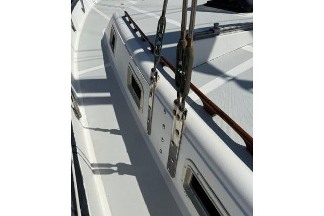 1982 Lancer 45 Motorsailer deck with rigging and windows in sunlight.