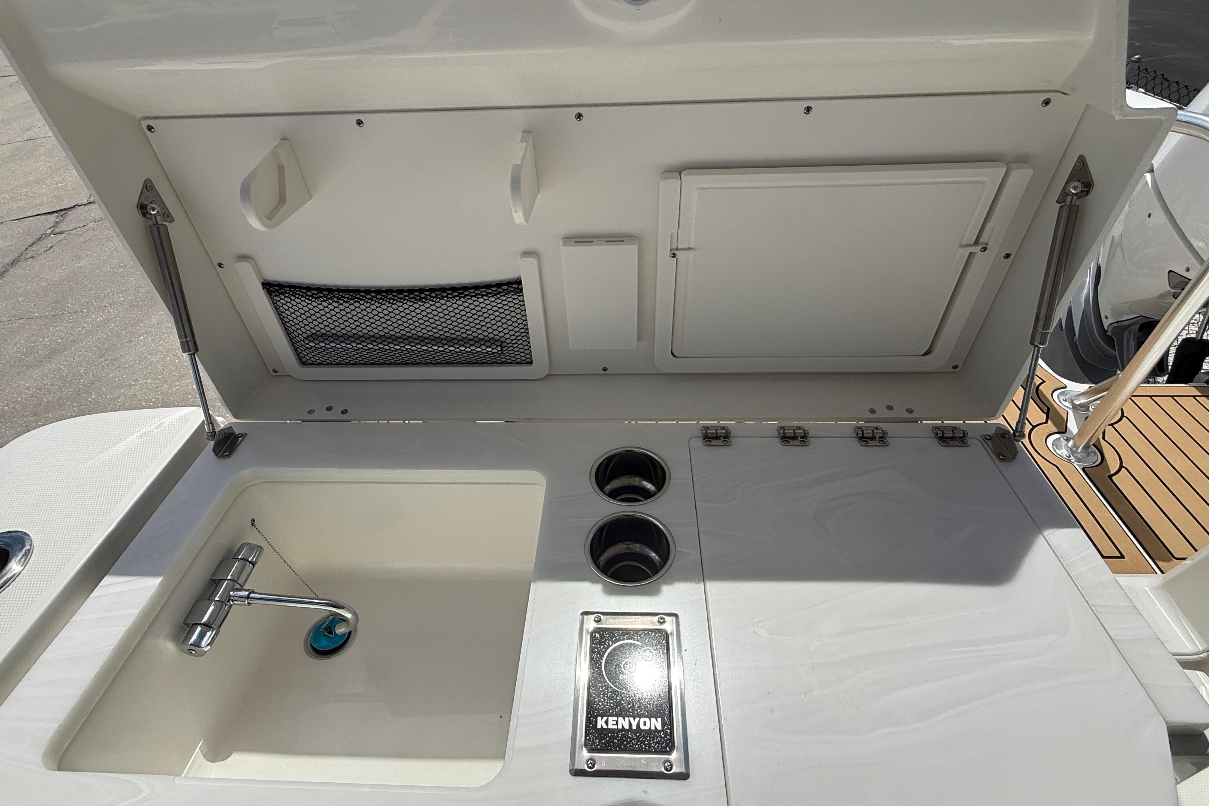 Outdoor sink and grill area on 2026 World Cat 400 DC-X Island boat.
