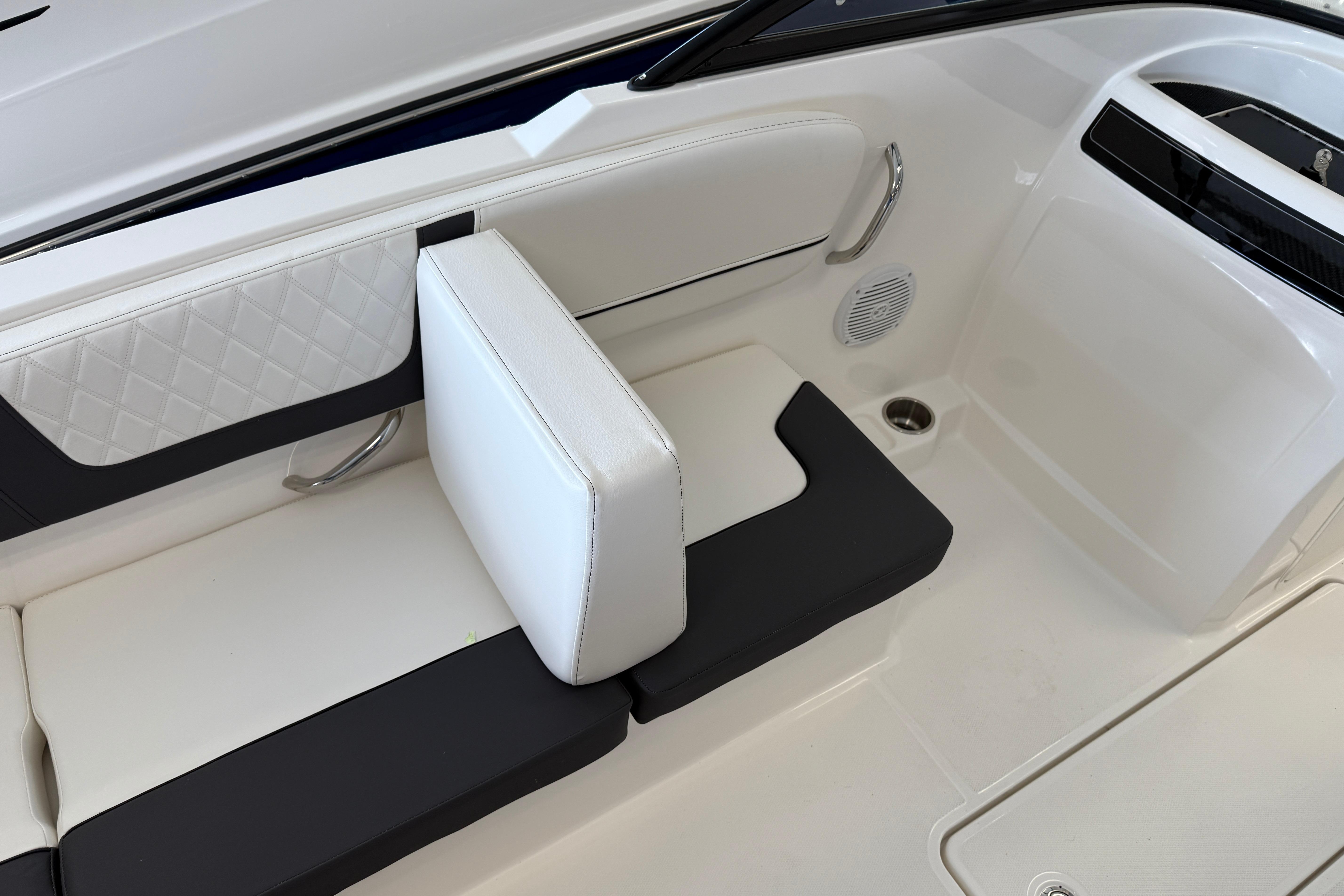 2025 Bayliner VR4 Bowrider OB interior seating with white and black upholstery.
