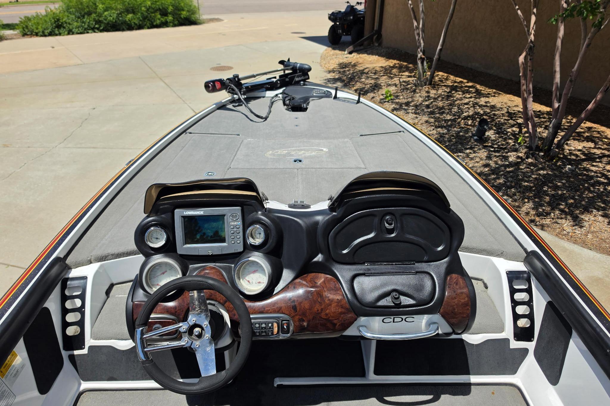 2008 Nitro Z-9 boat dashboard with steering wheel and electronic display.
