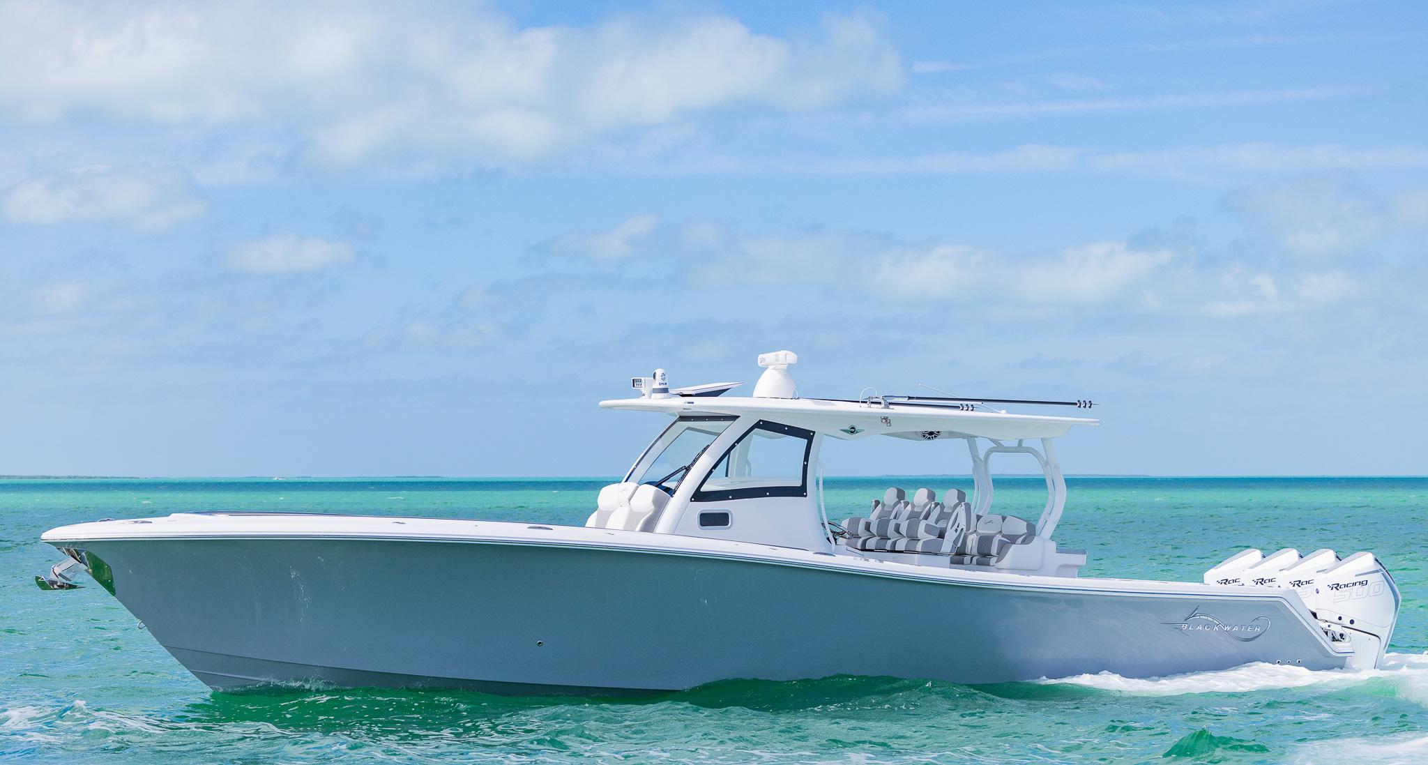 2025 Blackwater 43 Sportfish boat cruising on turquoise ocean waters under a clear sky.