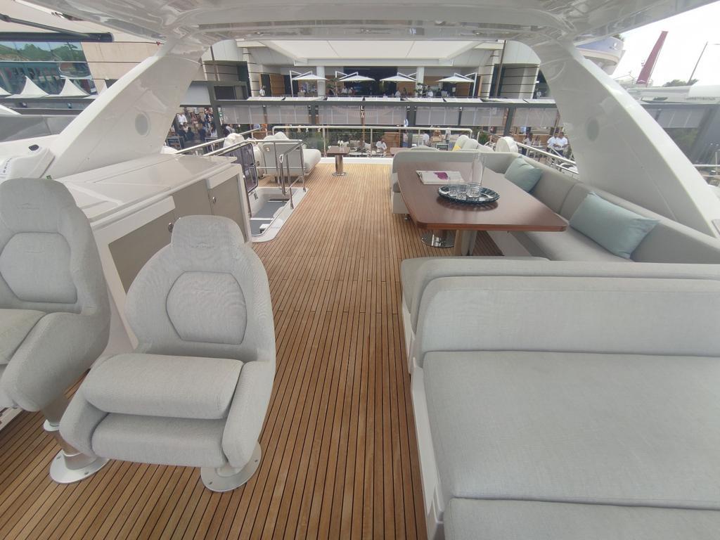 Luxurious 2020 Azimut Fly 72 yacht deck with seating and dining area.