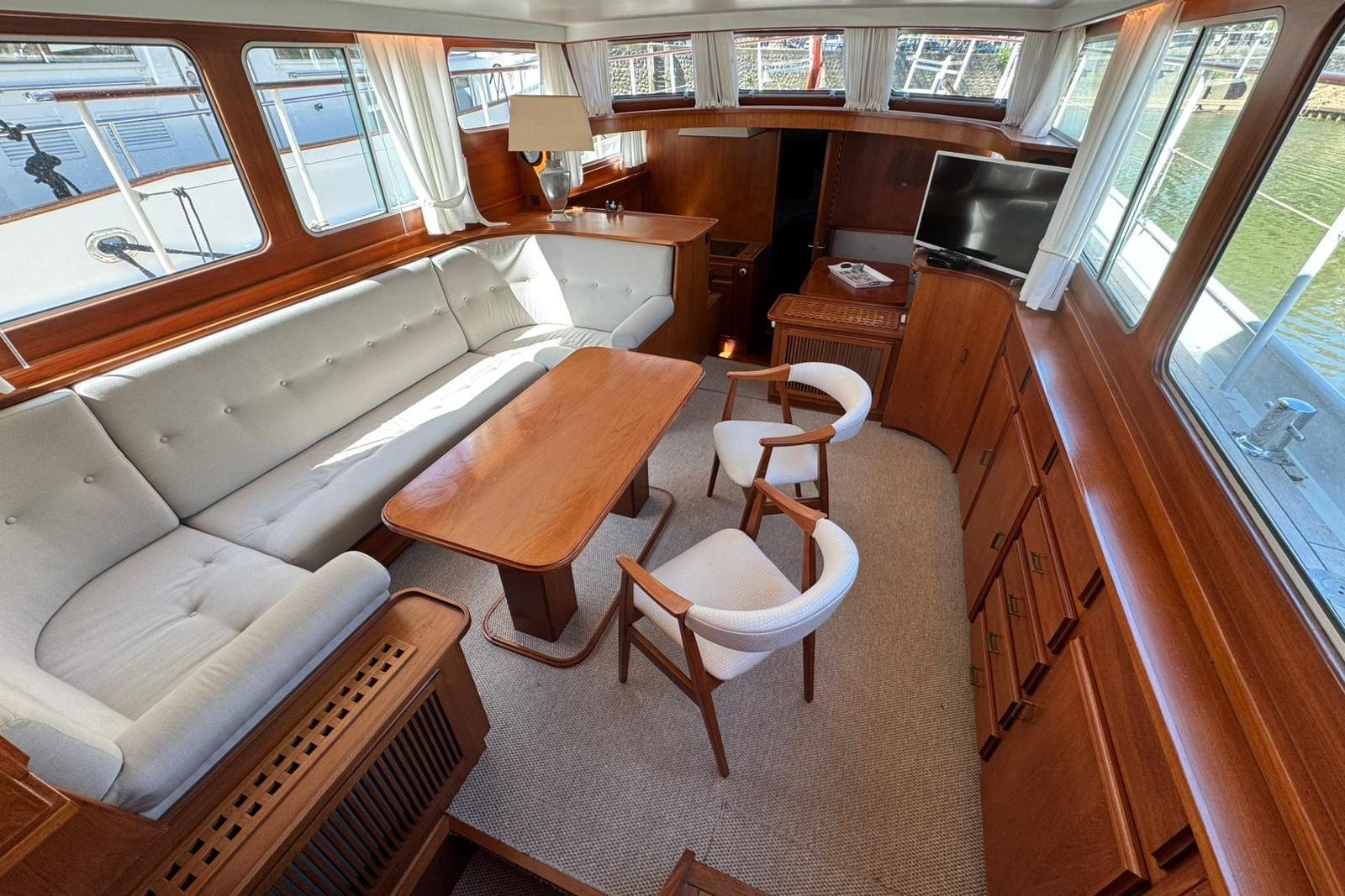 Luxurious 1991 Super Van Craft 15.50 yacht interior with elegant wood finish and comfortable seating.