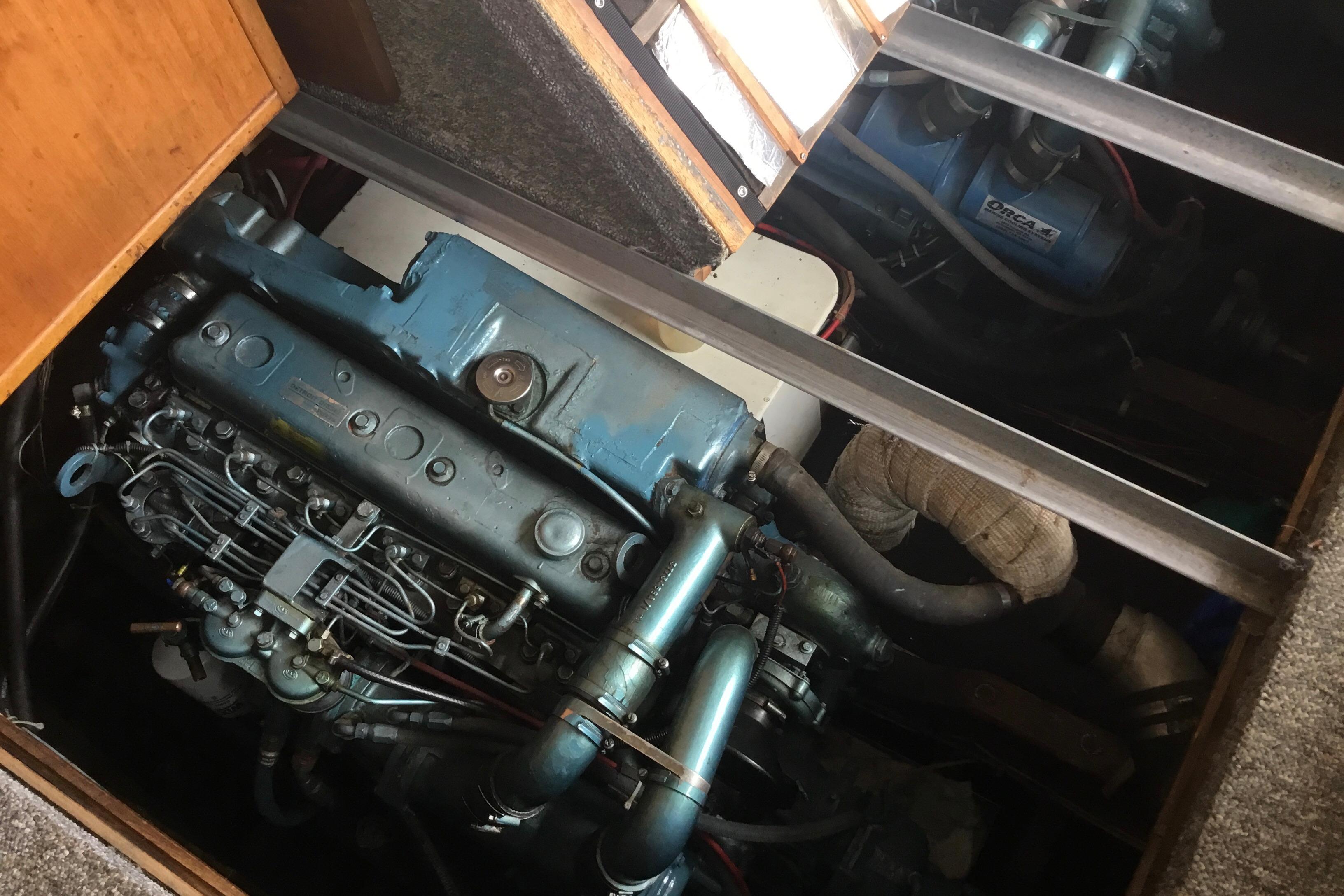 Engine compartment of a 1968 Egg Harbor Sedan, showcasing detailed mechanical components.