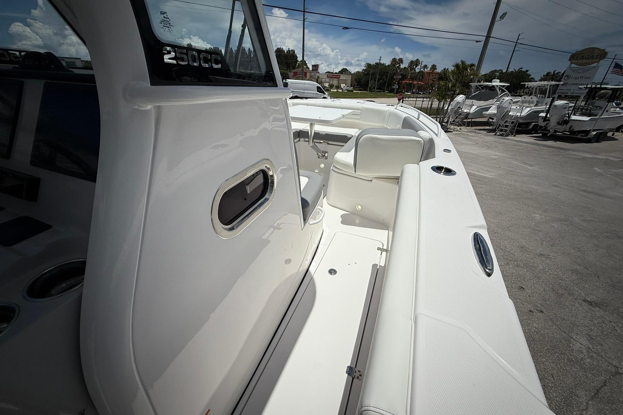2026 Edgewater 250CC boat interior with sleek white seating and modern design.