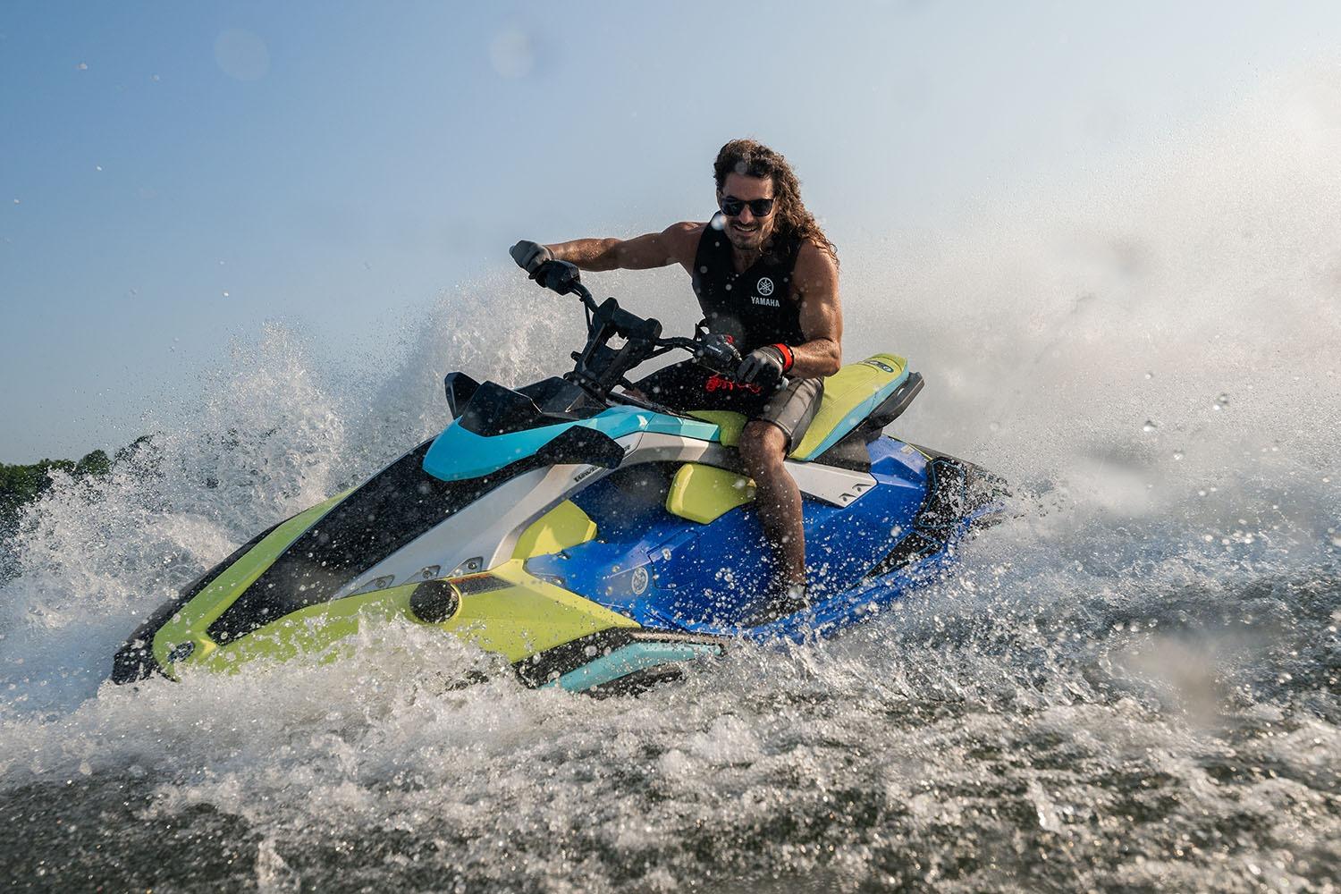 Manufacturer Provided Image: Man riding 2026 Yamaha WaveRunner JetBlaster PRO 2-Up on water, creating splashes.
