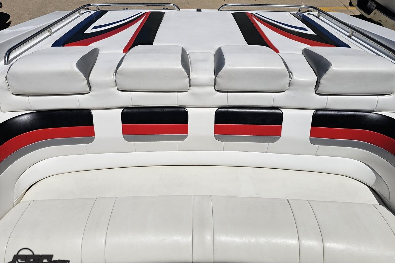 2005 Formula 271 FASTech boat interior with white, red, and black upholstery design.