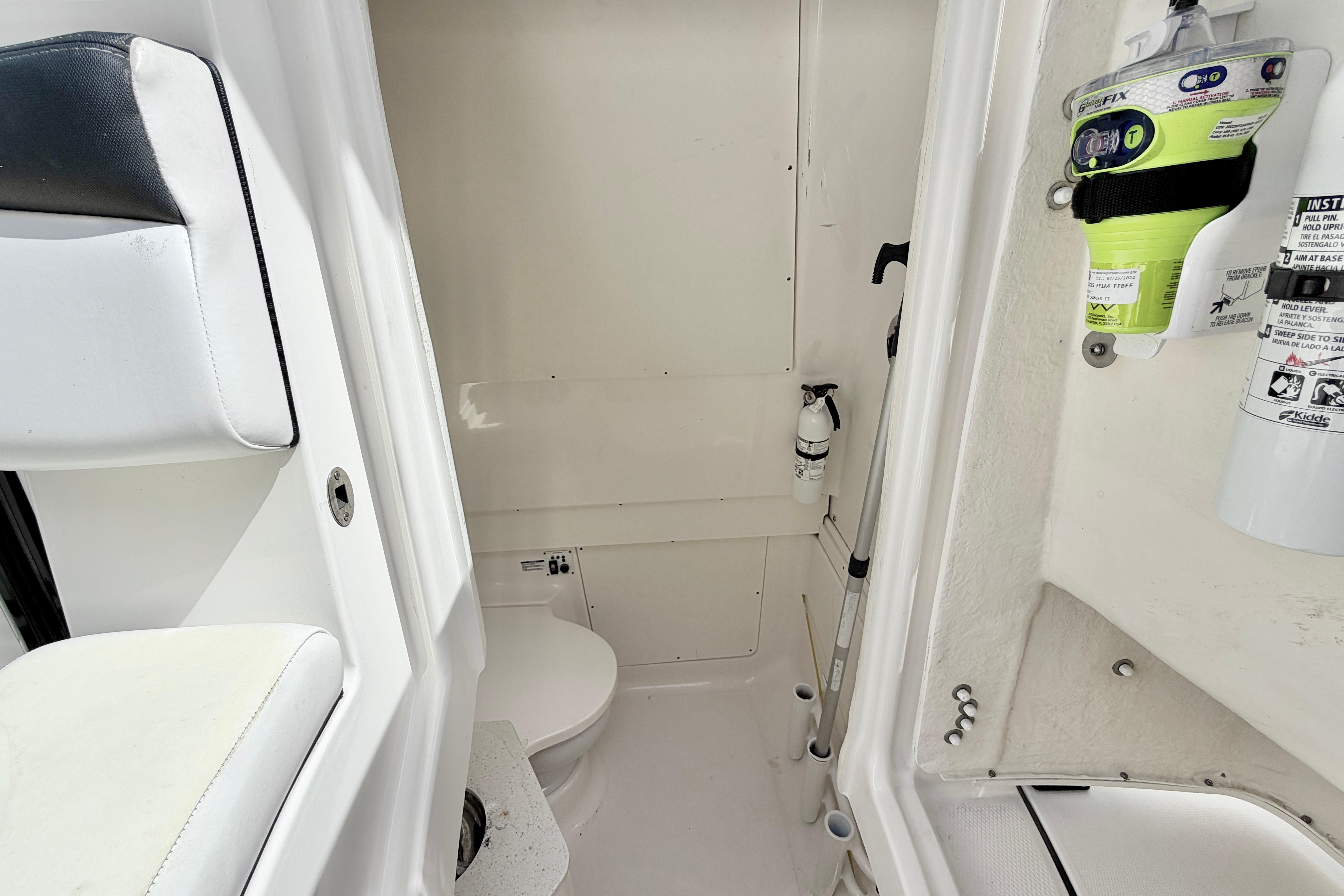 2021 Robalo R302 Center Console interior with safety equipment and seating.