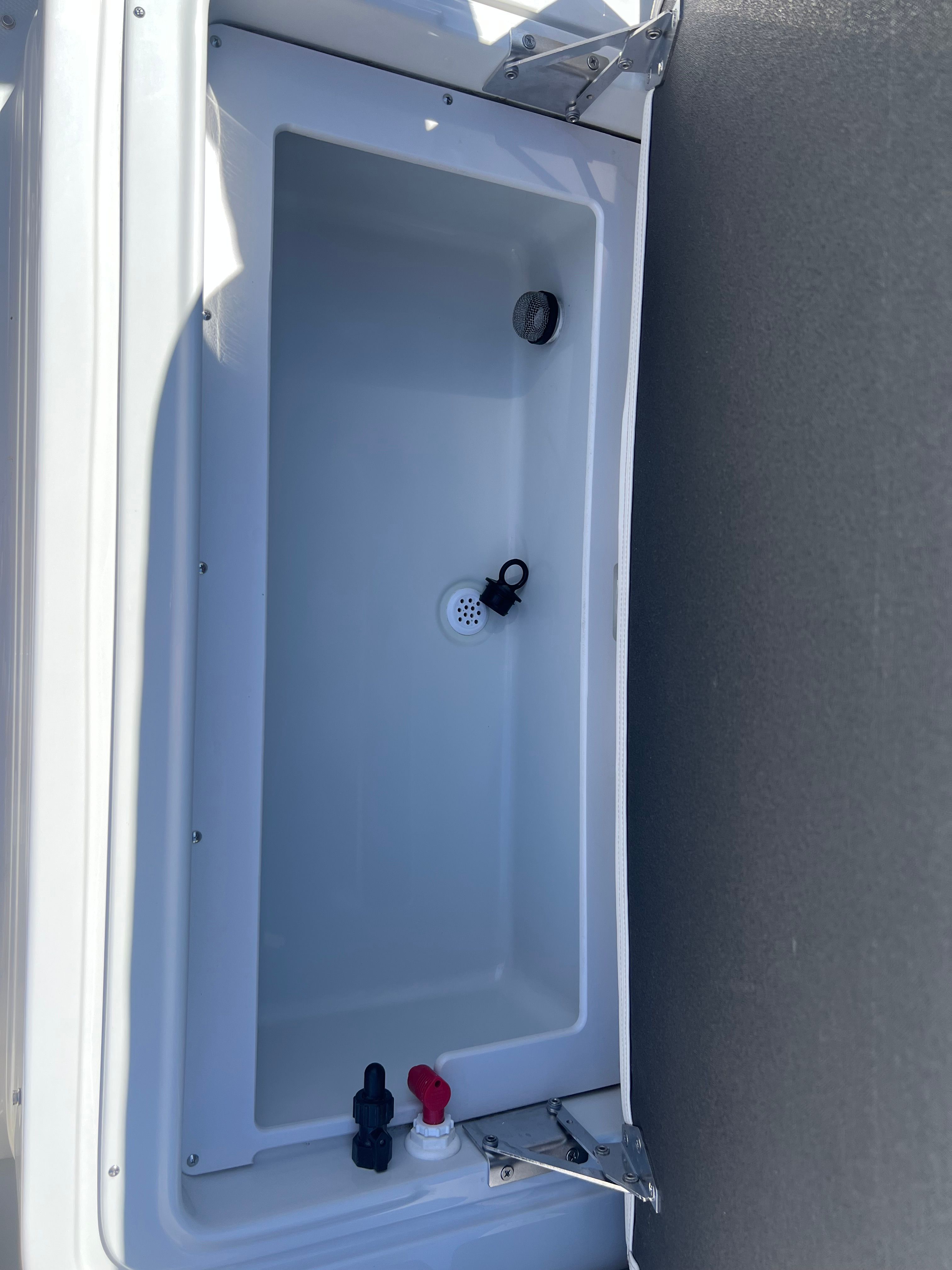 2024 Crownline Eclipse E210 XS boat cooler compartment detail.