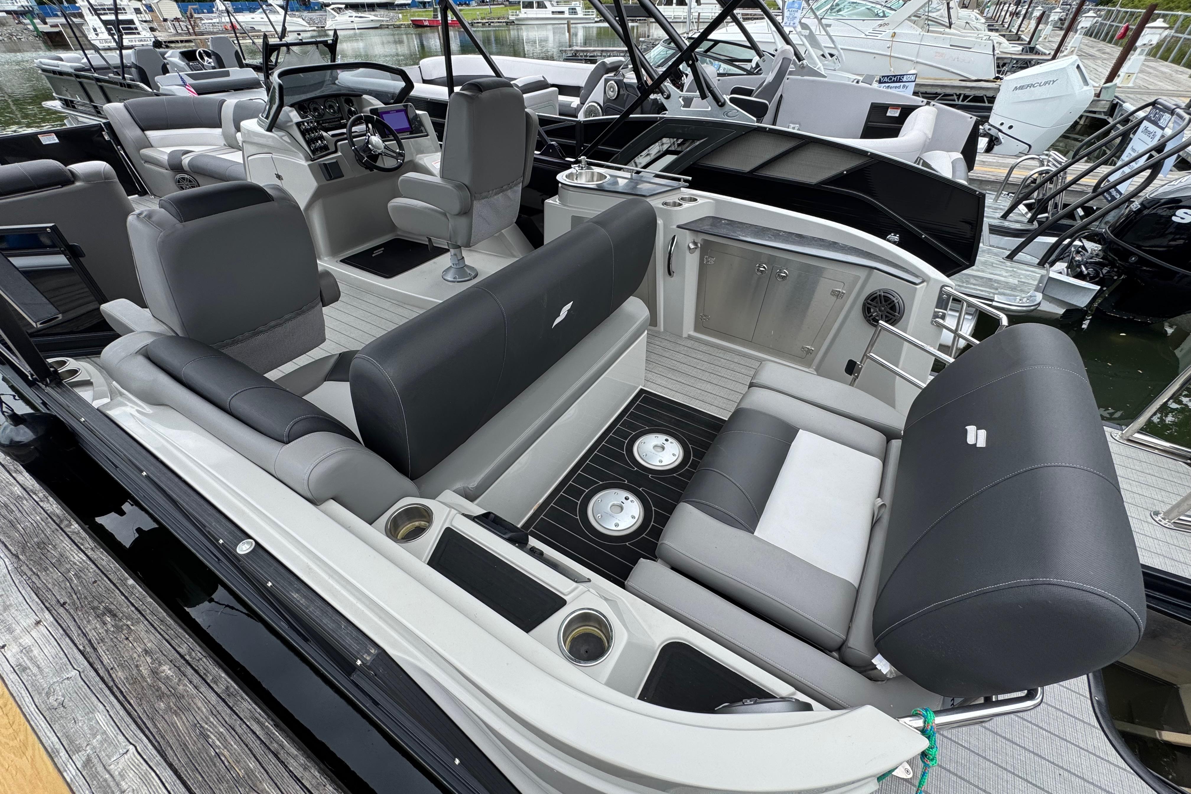 2023 Starcraft MX 25 DL DH pontoon boat interior with luxurious seating and modern dashboard.