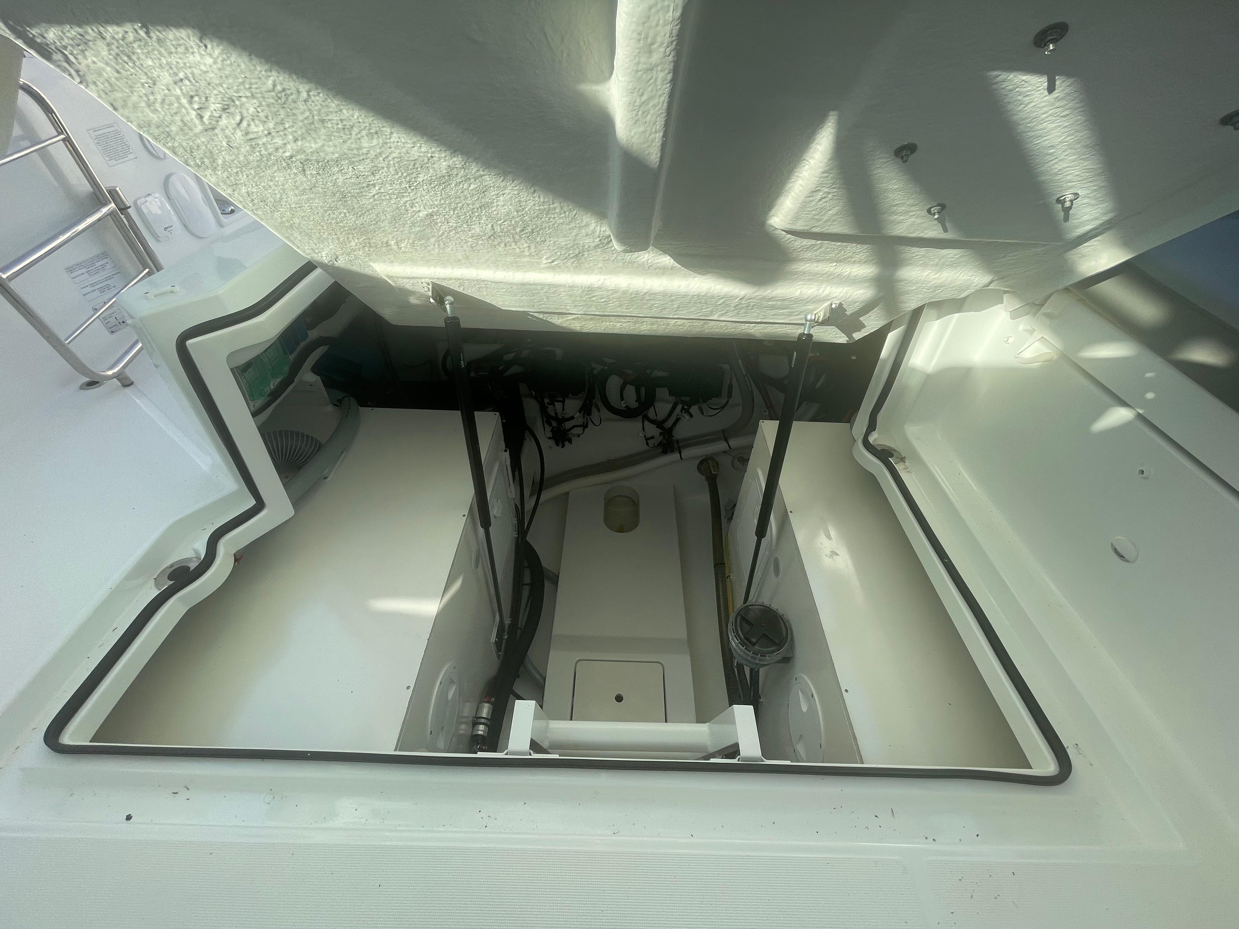Engine compartment of 2024 Beneteau Gran Turismo 32, showcasing interior details and structure.