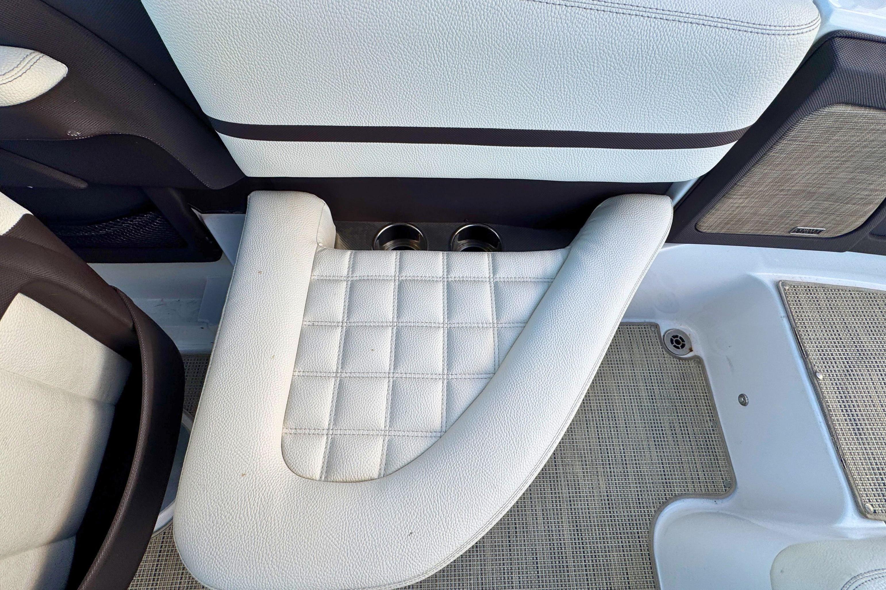 2019 Cobalt R3 boat interior with white cushioned seating and cup holders.