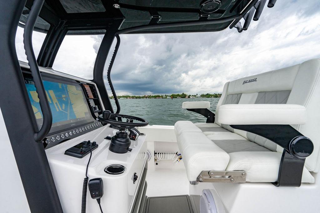 Interior of 2027 Reef Runner 280 boat with modern navigation system and seating.