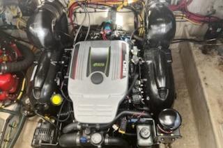 Engine of a 2012 Bayliner 285 Cruiser boat, showcasing detailed components.