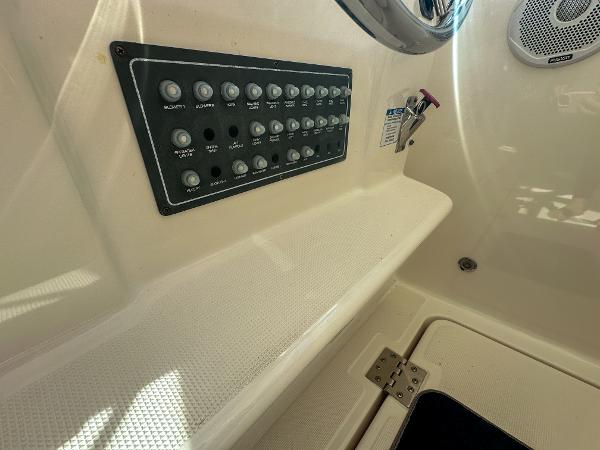 Control panel on 2006 Tiara Yachts 3200 Open, featuring multiple switches and speaker.