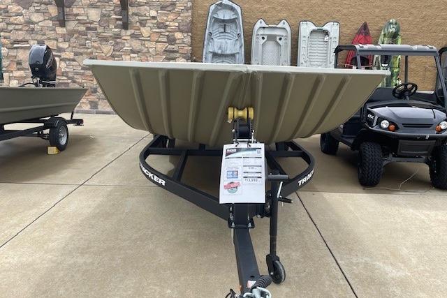 2025 Tracker Grizzly 2072 Utility boat on trailer, displayed outdoors.