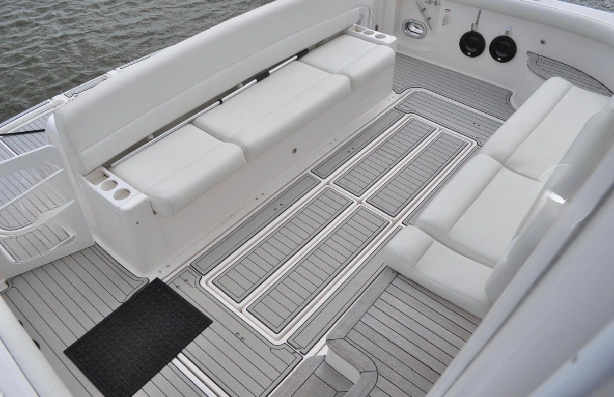 The image shows the cockpit of a 2005 Tiara Yachts 5200 Sovran with white seating.