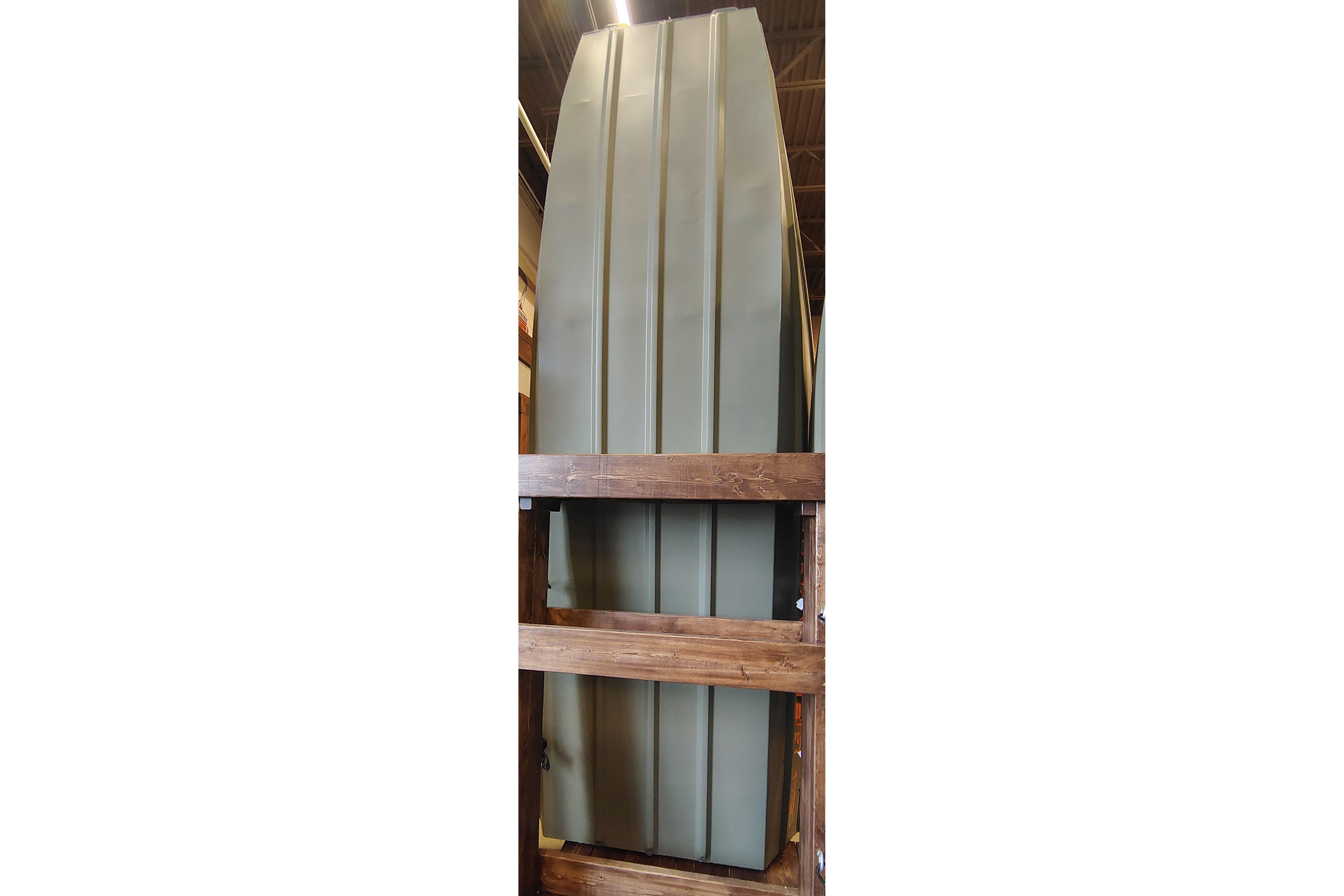 2026 Tracker Grizzly 12 Jon boat displayed vertically in a wooden frame.