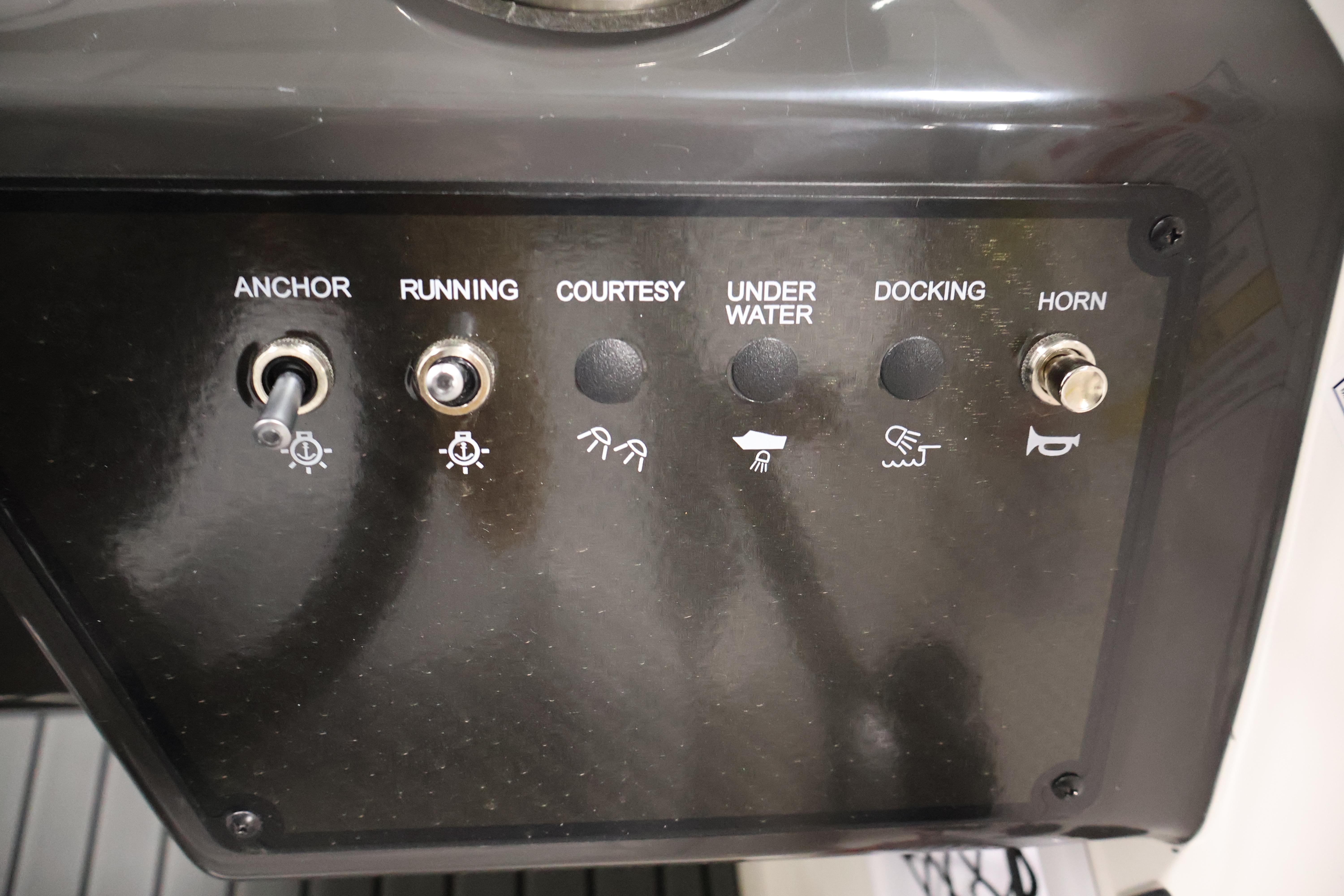 Control panel of 2026 Bayliner VR6 Bowrider I/O with switches for anchor, running, and horn.