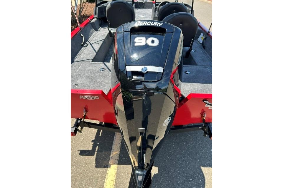 2026 Tracker Pro Guide V-16 WT boat with Mercury 90 engine, red and gray interior.