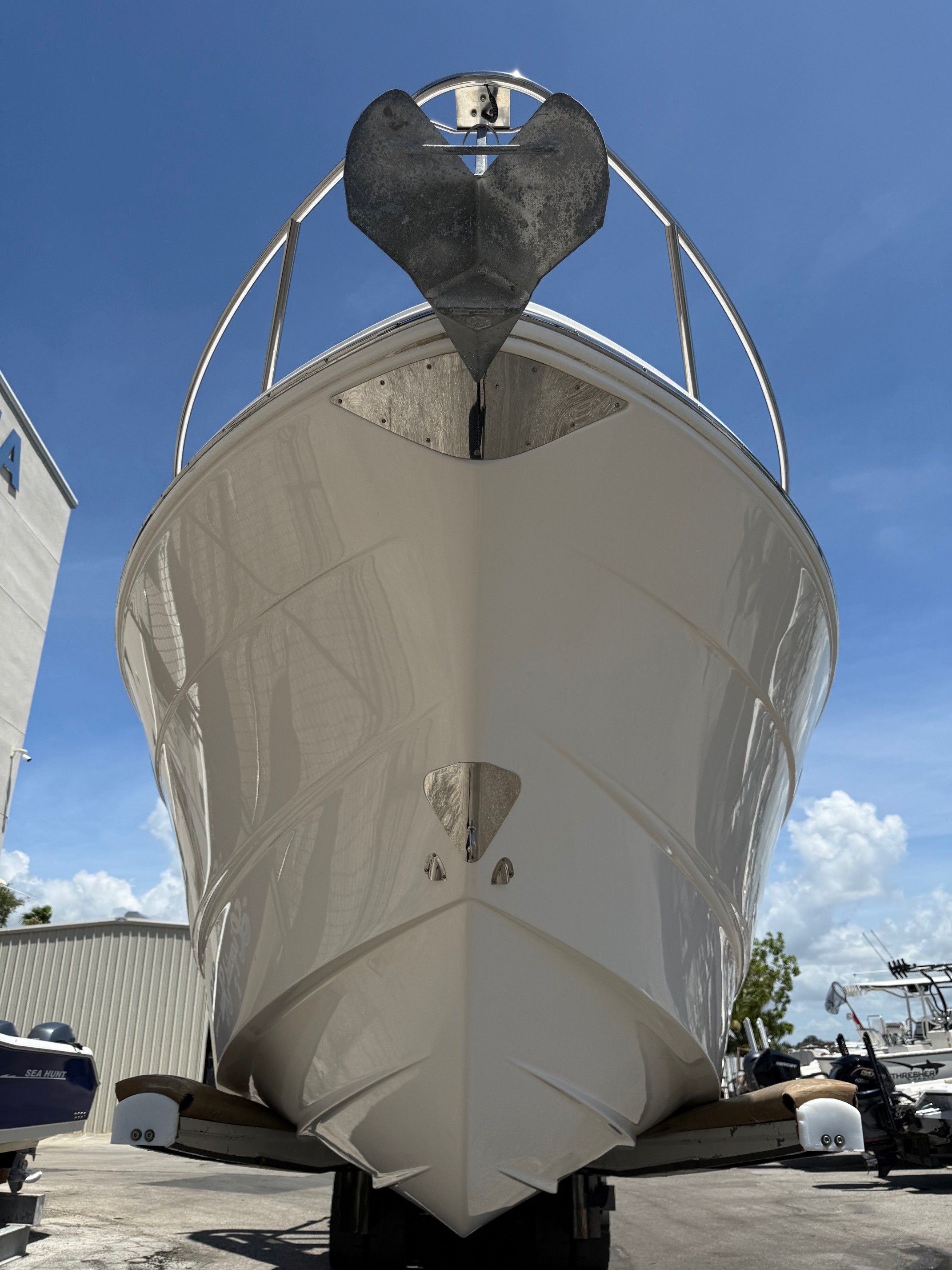 2018 Chaparral 270 Signature boat on trailer, blue sky.
