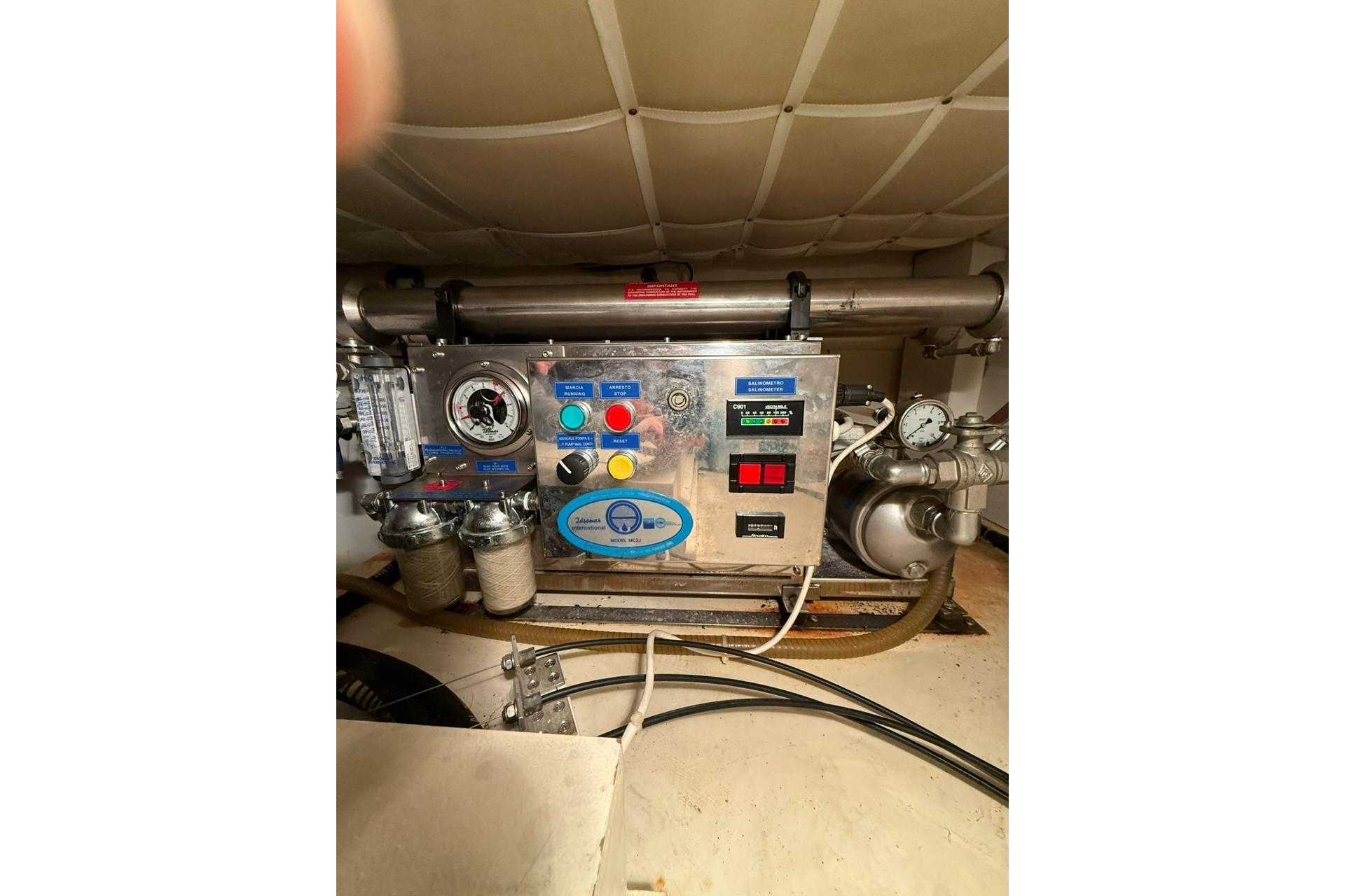 Engine room equipment on a 2007 Ferretti 500 Elite yacht, featuring control panel and gauges.