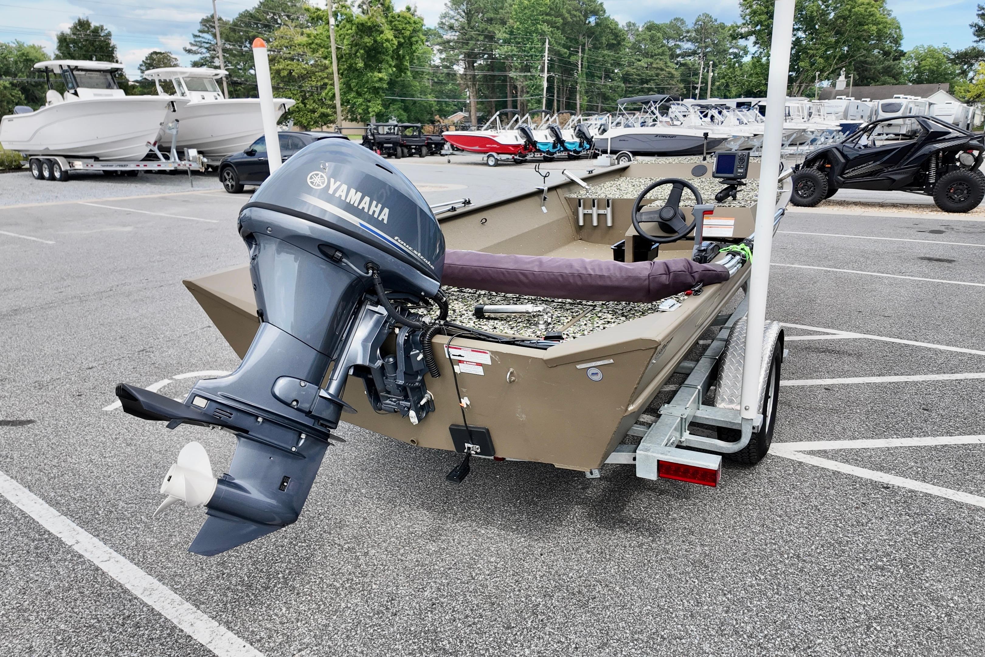 2025 G3 BOATS 1860 SC with Yamaha motor on trailer in parking lot.