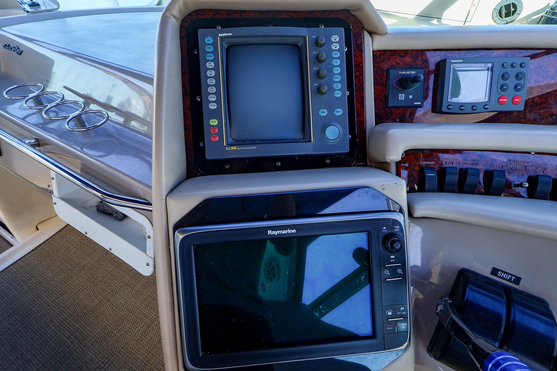 Control panel of a 1998 Sea Ray 500 Sundancer yacht with navigation equipment.