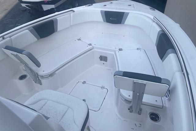2024 Robalo R230 Center Console boat interior with seating and storage compartments.