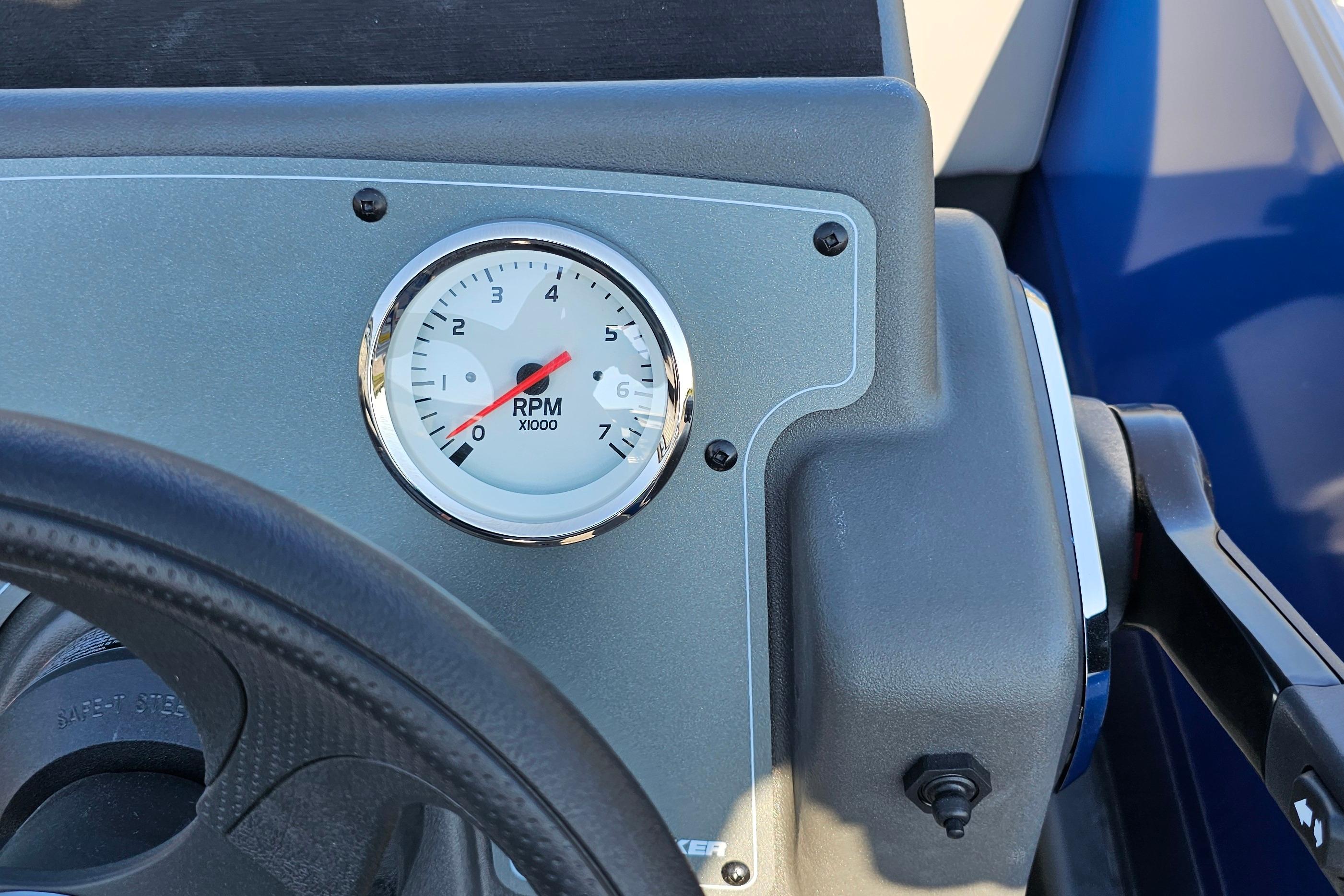 2026 Sun Tracker Party Barge 16 DLX dashboard with RPM gauge and steering wheel.