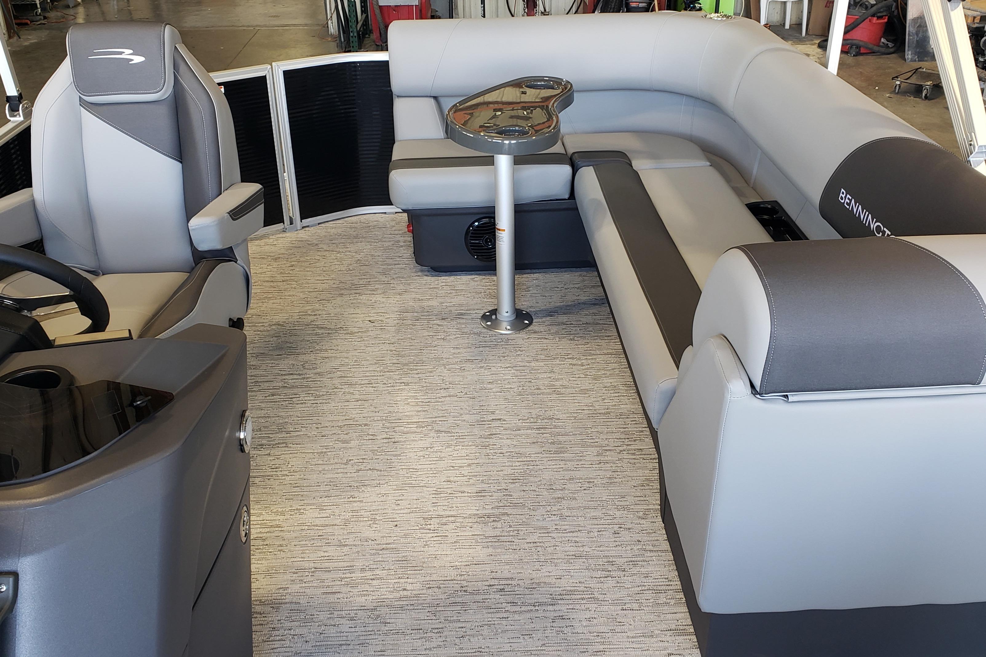 2026 Bennington 20SL pontoon boat interior with gray seating and modern design.