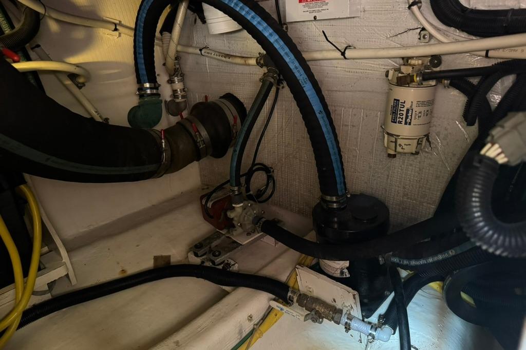 Engine compartment of a 2007 Sabre 34 Express with hoses and filter system.
