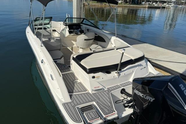 2022 Sea Ray SPX 210 Outboard boat docked, featuring spacious seating and sleek design.